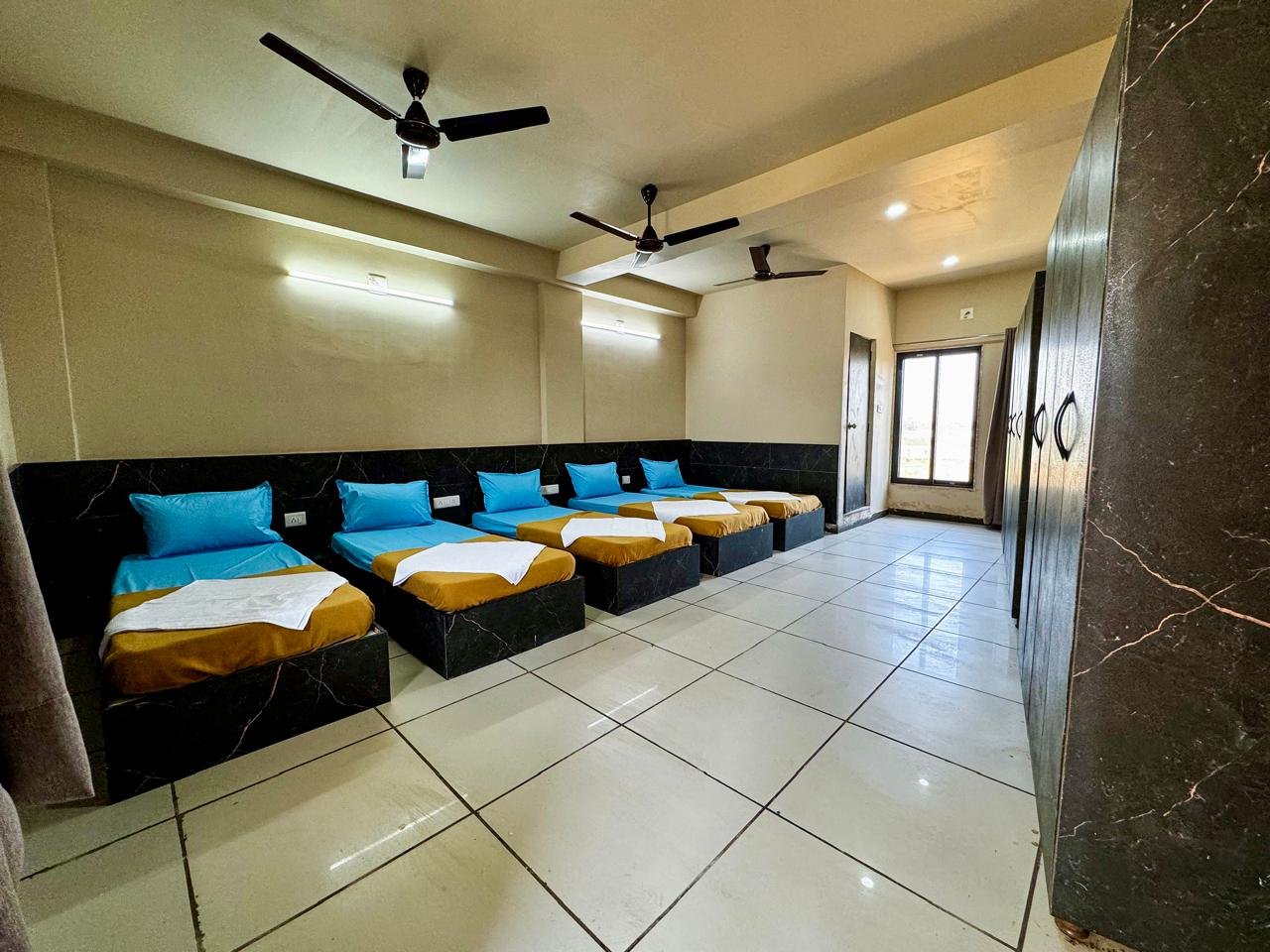 Modern bathroom with shower, toilet, and clean white tiles